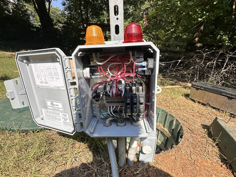 Septic pump and high-water alarm strobes wired at the tank in Woodstock, GA