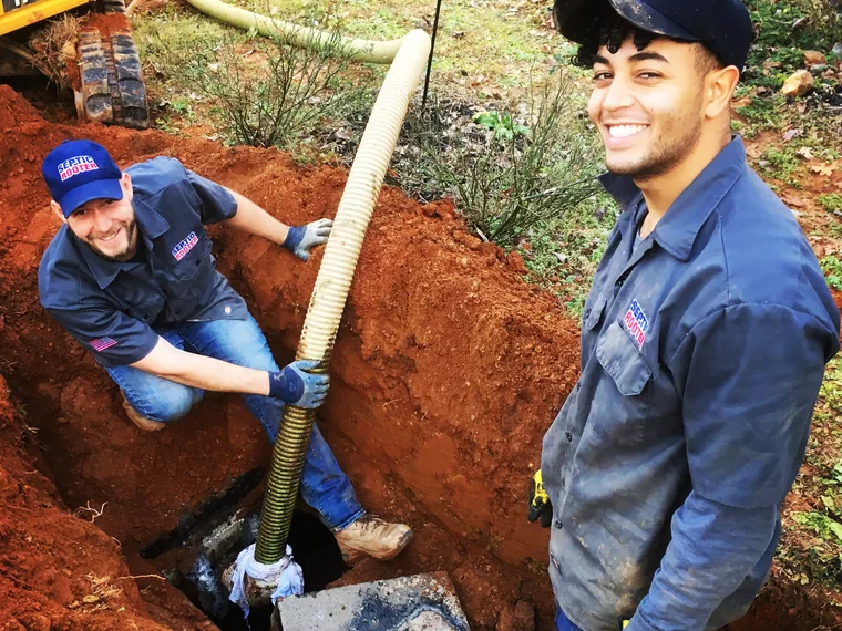 SepticRooter crew working in a trench on a Lawrenceville septic job