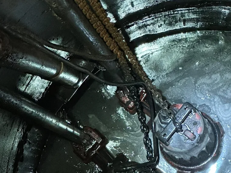 Submersible pump, float switches, and discharge piping inside a lift station wet well